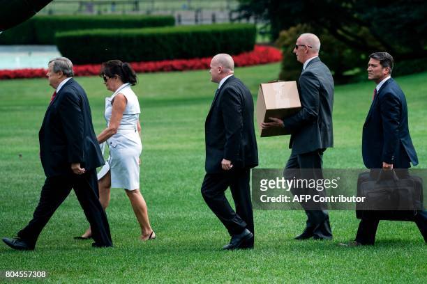 First lady Melania Trump's parents, Viktor Knavs and Amalija Knavs walk with staff to Marine One on the South Lawn of the White House June 30, 2017...