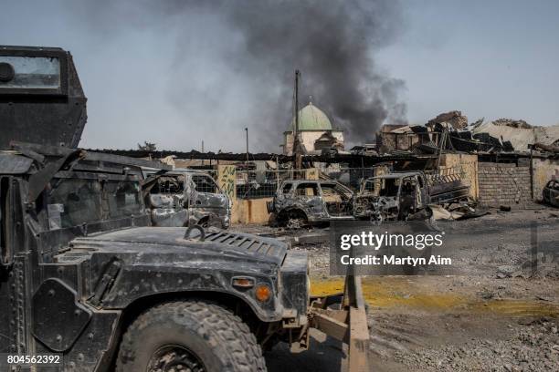 An Iraqi forces humvee in front of the destroyed al-Nuri mosque in the Old City of west Mosul where heavy fighting continues on June 30, 2017 in...