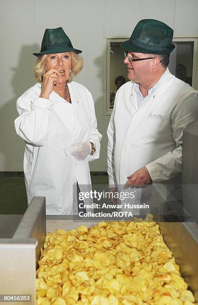 Managing Director Les Sayers takes Camilla, the Duchess of Cornwall on a tour of Tyrrells Potato Chip factory on March 31, 2008 in Leominster,...