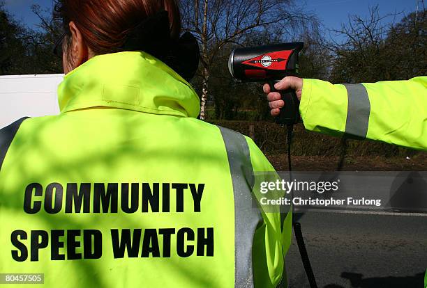 Volunteers from the Community Speed Watch track and record the speed of drivers through the village of Church Minshull on 1 April in Crewe, England....