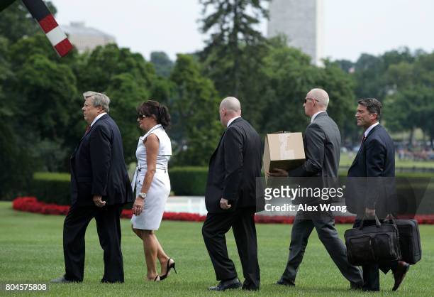 Parents of first Melania Trump, Viktor Knavs and Amalija Knavs , walk on the South Lawn prior to a Marine One departure at the White House June 30,...