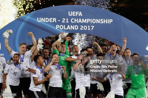 Maximilian Arnold of Germany lifts the trophy with his Germany team mates after the UEFA European Under-21 Championship Final between Germany and...