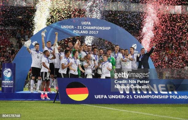 Maximilian Arnold of Germany lifts the trophy with his Germany team mates after the UEFA European Under-21 Championship Final between Germany and...
