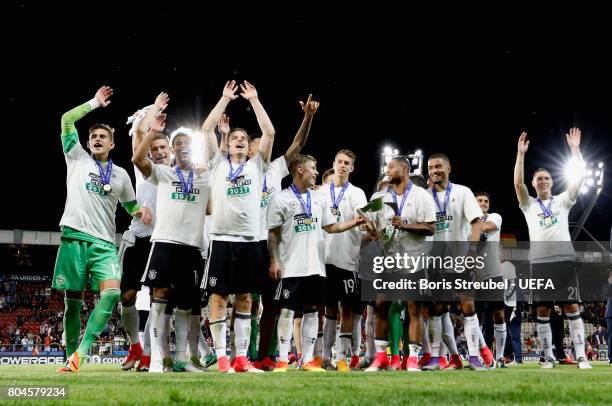 Serge Gnabry of Germany celebrates with the trophy with his Germany team mates after the UEFA European Under-21 Championship Final between Germany...