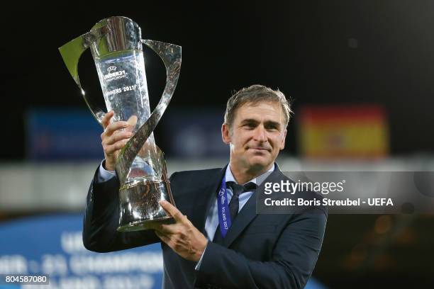 Stefan Kuntz, coach of Germany poses with the trophy after the UEFA European Under-21 Championship Final between Germany and Spain at Krakow Stadium...