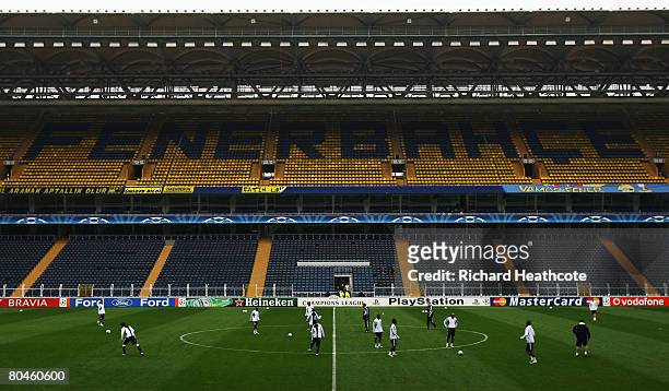 General view as the players warm up in the stadium during the Chelsea Training session ahead of their UEFA Champions League Quarter Final match...