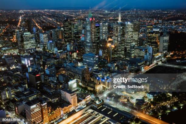 arial view of melbourne at night - victoria aerial stock pictures, royalty-free photos & images