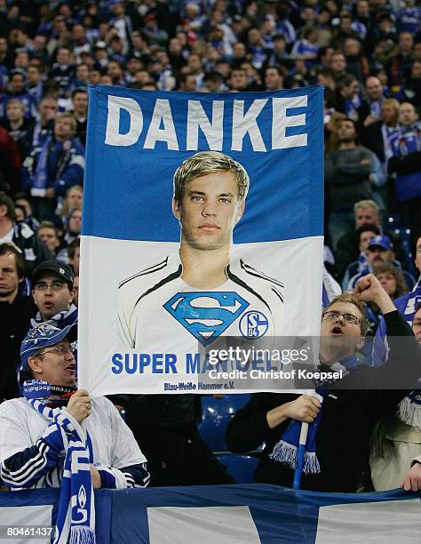 Fans of Schalke show a banner prior the UEFA Champions League quarter final first leg match between FC Schalke 04 and FC Barcelona at the Veltins...