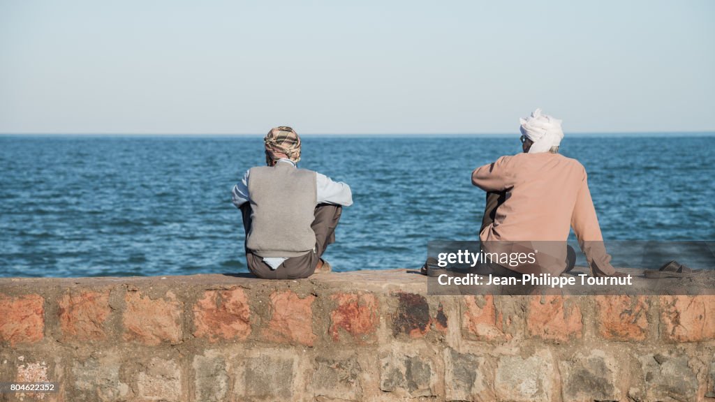 Inhabitants of Hormuz Island watching the sea, Persian Gulf, Hormozgan Province, Southern Iran
