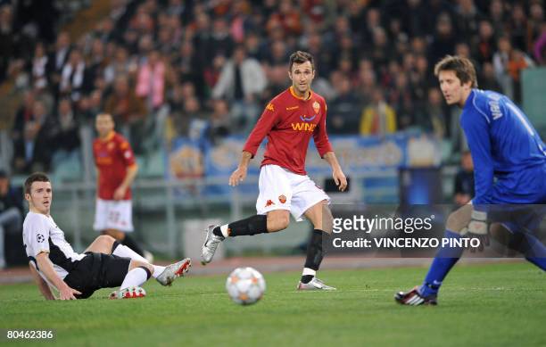 Roma's of Serbia Montenegro forward Mirko Vucinic misses a goal as Manchester United players, midfielder Michael Carrick and goalkeeper Edwin van der...