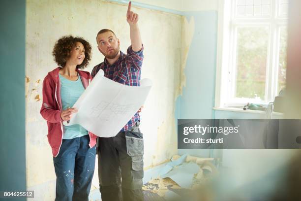 remodelling their home - home improvement contractor stock pictures, royalty-free photos & images