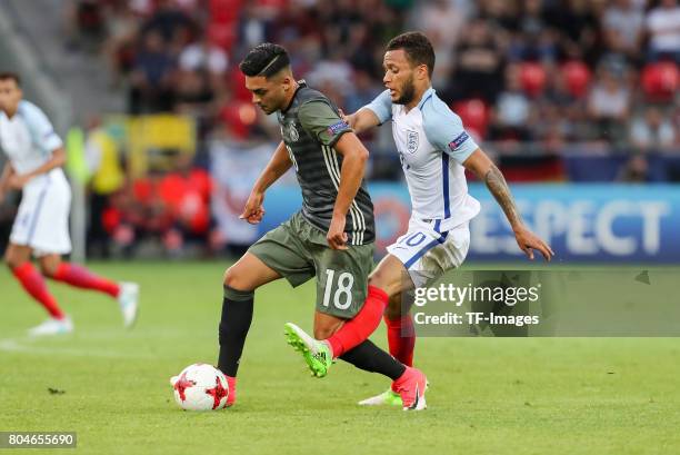 Nadiem Amiri of Germany and Lewis Baker of England battle for the ball during the UEFA European Under-21 Championship Semi Final match between...