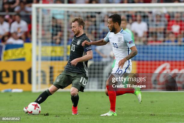 Maximilian Arnold of Germany and Lewis Baker of England battle for the ball during the UEFA European Under-21 Championship Semi Final match between...