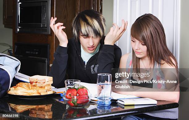 teenage couple studying - peanut butter and jelly sandwich on plate stock pictures, royalty-free photos & images