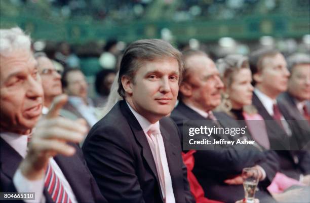 Businessman Donald Trump sitting near father Fred Trump ringside at Tyson vs Holmes Convention Hall in Atlantic City, New Jersey January 22 1988.