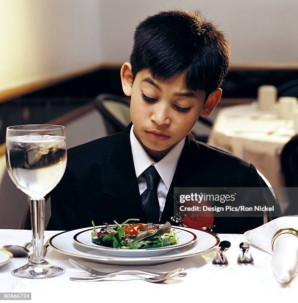 a boy at a wedding reception - picky eater stock pictures, royalty-free photos & images