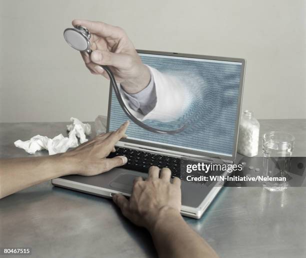 doctor's hand coming out of laptop, close-up of hands - hand coming out of screen stock pictures, royalty-free photos & images