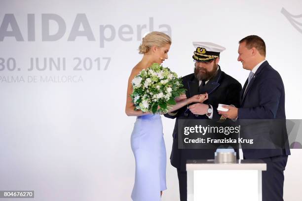 Godmother Lena Gercke, captain Boris Becker and AIDA President Felix Eichhorn during the Christening of AIDAperla Cruise Ship on June 30, 2017 in...