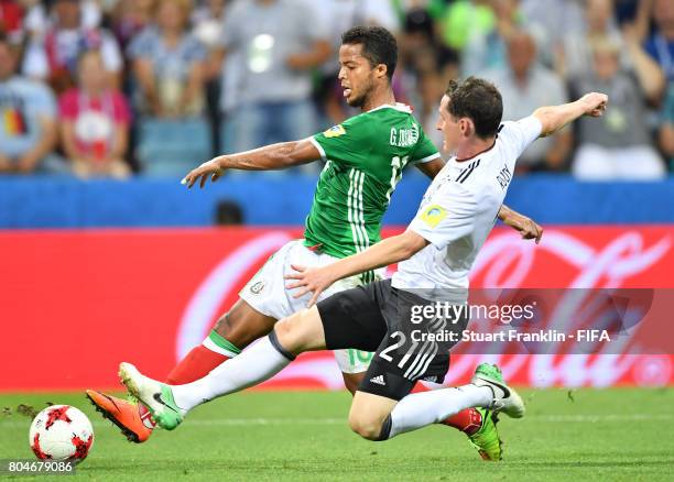 Sebastian Rudy of Germany is challenged by Giovani Dos Santos of Mexico during the FIFA Confederations Cup Russia 2017 semi final match between...