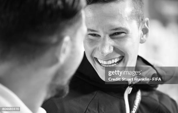 This images was converted into black and white from a color original.) Julian Draxler of Germany in the mixed zone after the FIFA Confederations Cup...