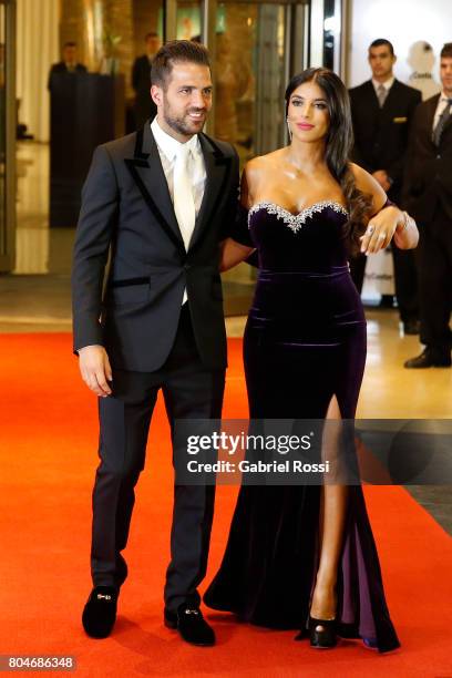 Spanish soccer player Cesc Fabregas and his wife Daniella Semaan pose for pictures on the red carpet during Lionel Messi and Antonela Rocuzzo's...