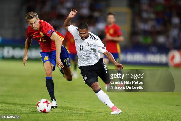 Marcos Llorente of Spain and Serge Gnabry of Germany competes for the ball during the UEFA U21 Final match between Germany and Spain at Krakow...