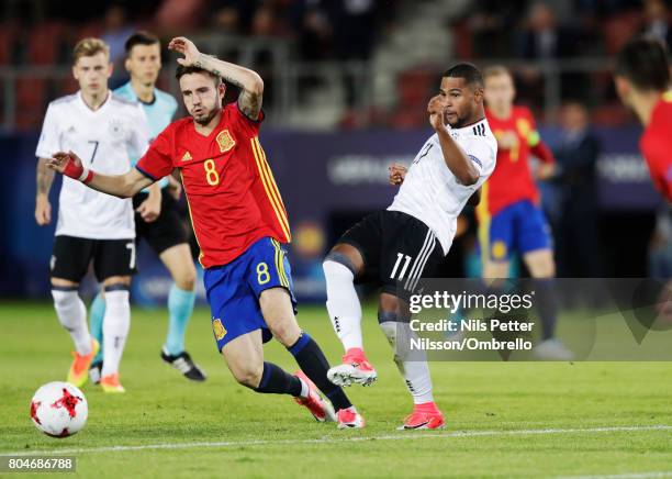 Saúl Ñíguez of Spain and Serge Gnabry of Germany competes for the ball during the UEFA U21 Final match between Germany and Spain at Krakow Stadium on...