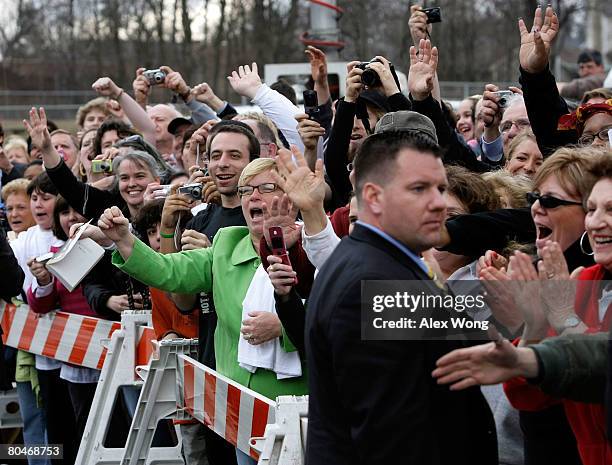 Supporters of Democratic U.S. Presidential hopeful Sen. Barack Obama wave as Obama arrives for a town hall meeting at Dunmore Community Center April...