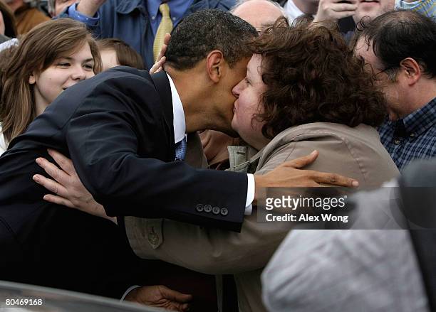 Democratic U.S. Presidential hopeful Sen. Barack Obama kisses a supporter as he greets the over flow crowd prior to a town hall meeting at Dunmore...