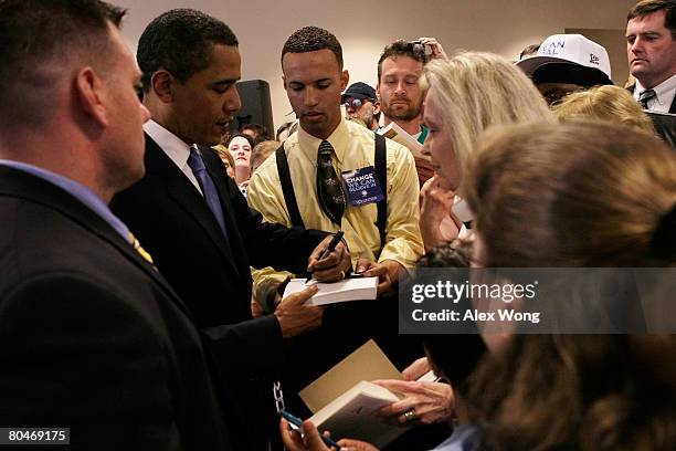 Democratic U.S. Presidential hopeful Sen. Barack Obama signs autograph for Rhonda Koslosky of Shavertown, Pennsylvania, prior to a town hall meeting...