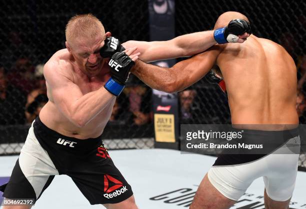 Penn punches Dennis Siver of Germany in their featherweight bout during the UFC Fight Night event at the Chesapeake Energy Arena on June 25, 2017 in...
