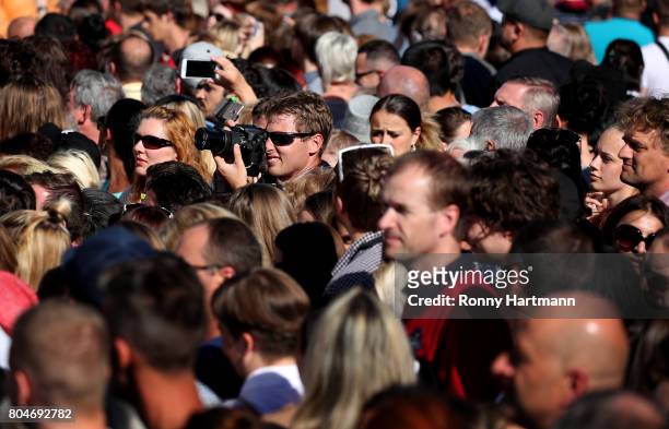 People wait for guests before the opening ceremony of the 52st Karlovy Vary International Film Festival on June 30, 2017 in Karlovy Vary, Czech...