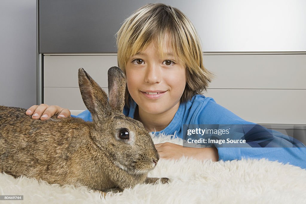 Boy and pet rabbit