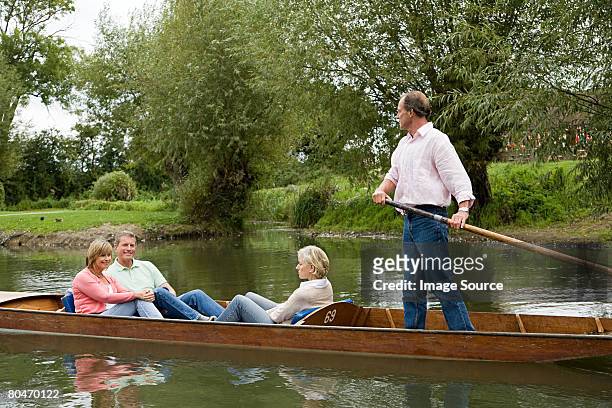 mature friends punting - oxford england stock pictures, royalty-free photos & images