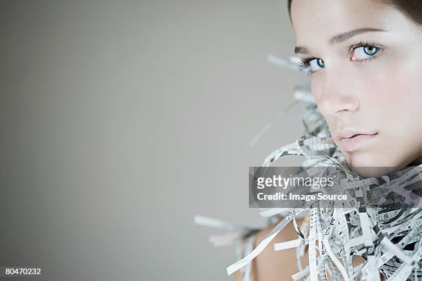 portrait of a woman wearing a newspaper accessory - shredded newspaper stock pictures, royalty-free photos & images