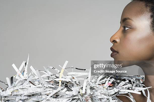 portrait of a woman wearing newspaper accessory - shredded newspaper stock pictures, royalty-free photos & images