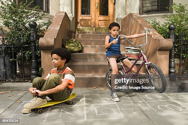 boys on sidewalk - fashion kids stock pictures, royalty-free photos & images