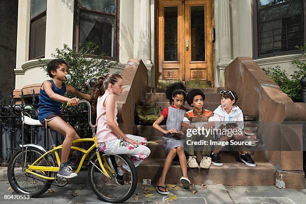kids outside house - brooklyn stoop stock pictures, royalty-free photos & images