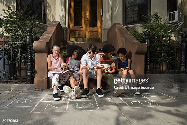 kids outside house - street games stock pictures, royalty-free photos & images