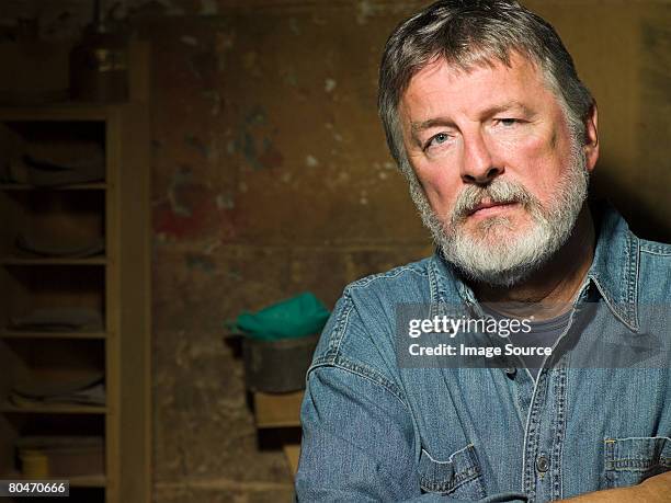 mature man wearing a denim shirt - one mature man only stock pictures, royalty-free photos & images