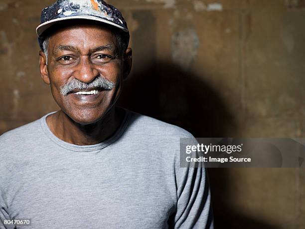 smiling senior man - moustaches stockfoto's en -beelden