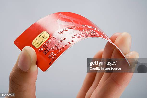 a person holding a credit card - bent hand stock pictures, royalty-free photos & images