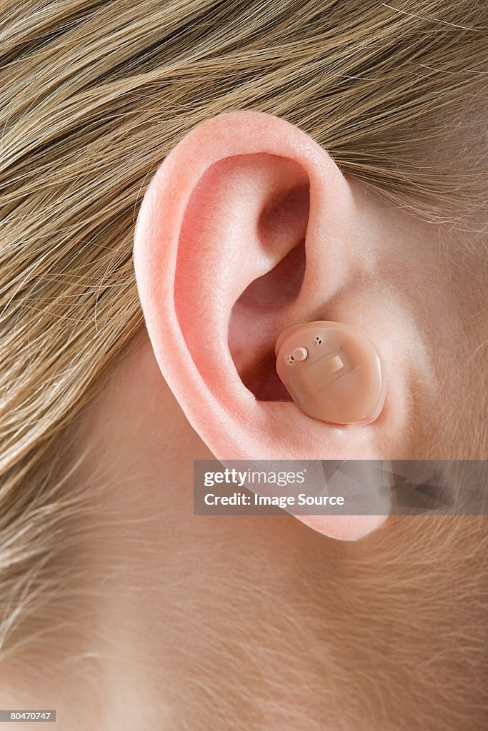 A woman wearing a hearing aid