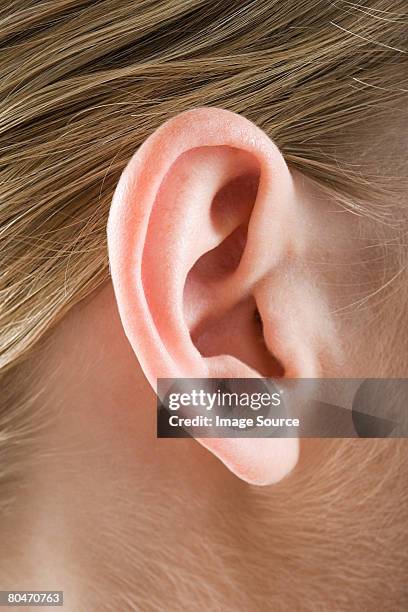 close up of a womans ear - ear close up stock-fotos und bilder