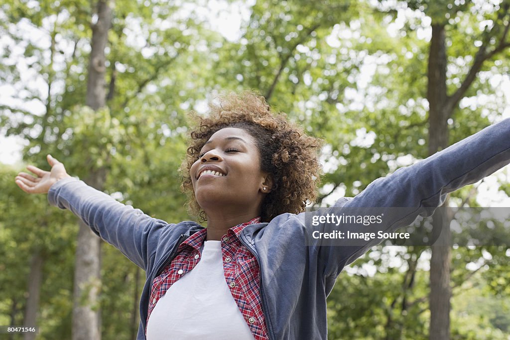 Happy woman in forest