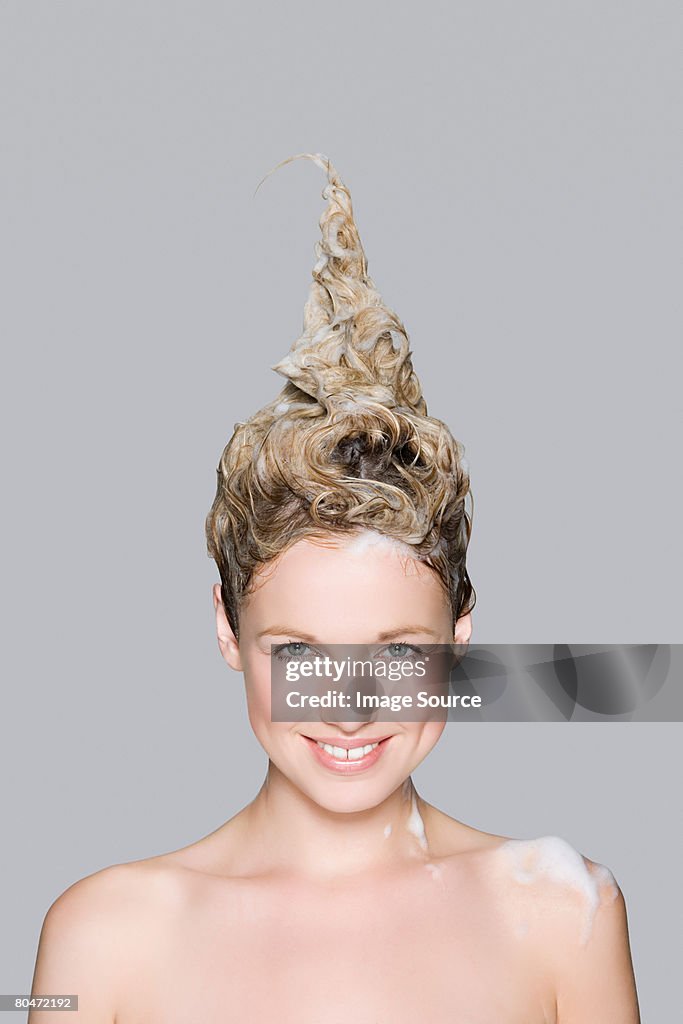 Portrait of a woman with shampoo in her hair