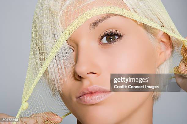 portrait of a woman wearing a hairnet - hair net stock pictures, royalty-free photos & images