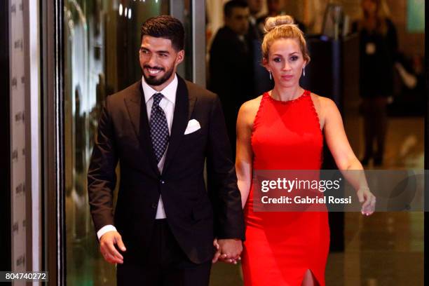 Uruguayan soccer player Luis Suarez and his wife Sofia Balbi pose for pictures on the red carpet during Lionel Messi and Antonela Rocuzzo's Wedding...