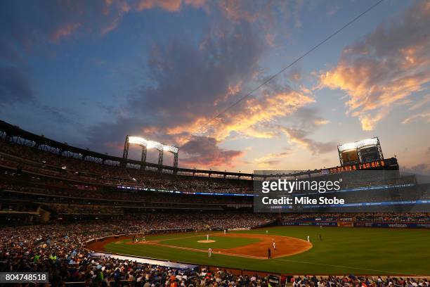 The sunsets in the fourth inning during the game between the New York Mets and the Philadelphia Phillies at Citi Field on June 30, 2017 in the...