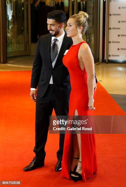 Uruguayan soccer player Luis Suarez and his wife Sofia Balbi pose for pictures on the red carpet during Lionel Messi and Antonela Rocuzzo's Wedding...